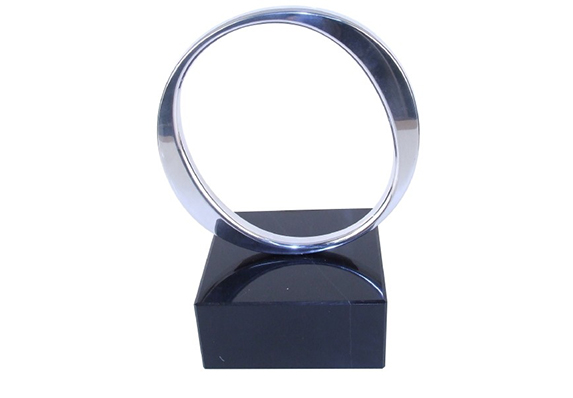 Circle ring polished aluminum on marble base